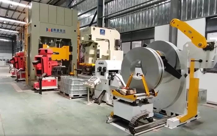 A Typical Automated Stamping Line Built With Our 3-In-1 Coil Feeder, Hydraulic Press, And 10 Kg Swing-Arm Robots